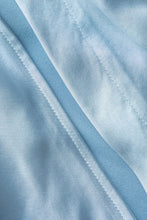 asimetrik kesim yırtmaçlı düğme detaylı etek